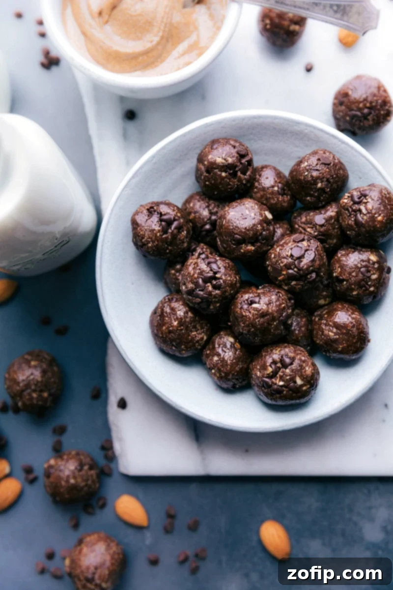 High-Protein Chocolate Bliss Balls 2 Close-up of freshly made chocolate protein balls on a white plate