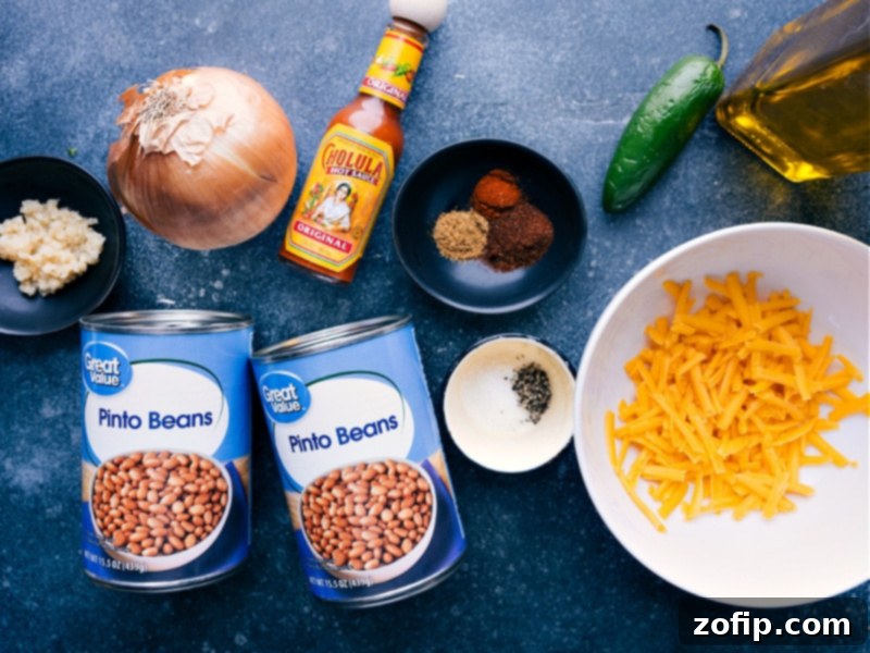 The best Rice And Beans is a quick 20-minute meal that is hearty, filling, and vegetarian! Recipe via ChelseasMessyApron showcases simple, fresh, family-friendly ingredients for a delicious dinner. Ingredient shot showing all the components used in this savory rice and beans dish