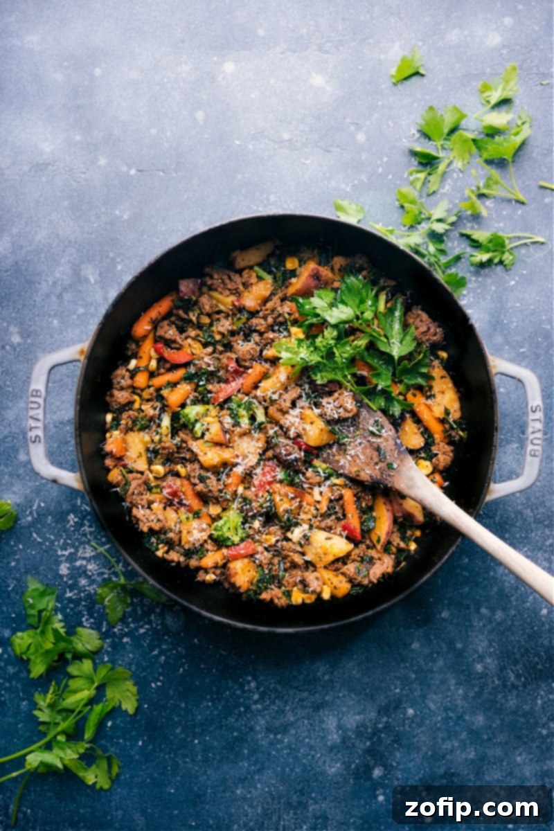 A vibrant Sausage and Veggie Skillet, brimming with colorful vegetables and seasoned sausage, still in the pan