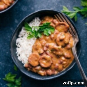 Classic Red Beans and Rice 3 Close-up of creamy Red Beans and Rice with sausage.
