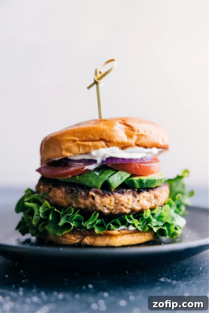 Green Chile Turkey Burger fully dressed and on a plate