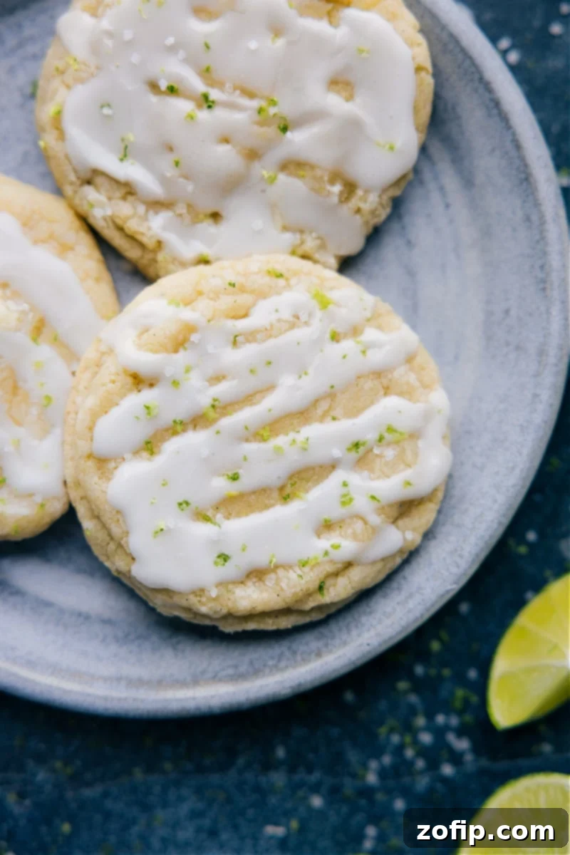 The Absolute Best Lime Cookies Irresistible Lime Cookies adorned with a smooth, zesty lime glaze and a sprinkle of fresh lime zest.