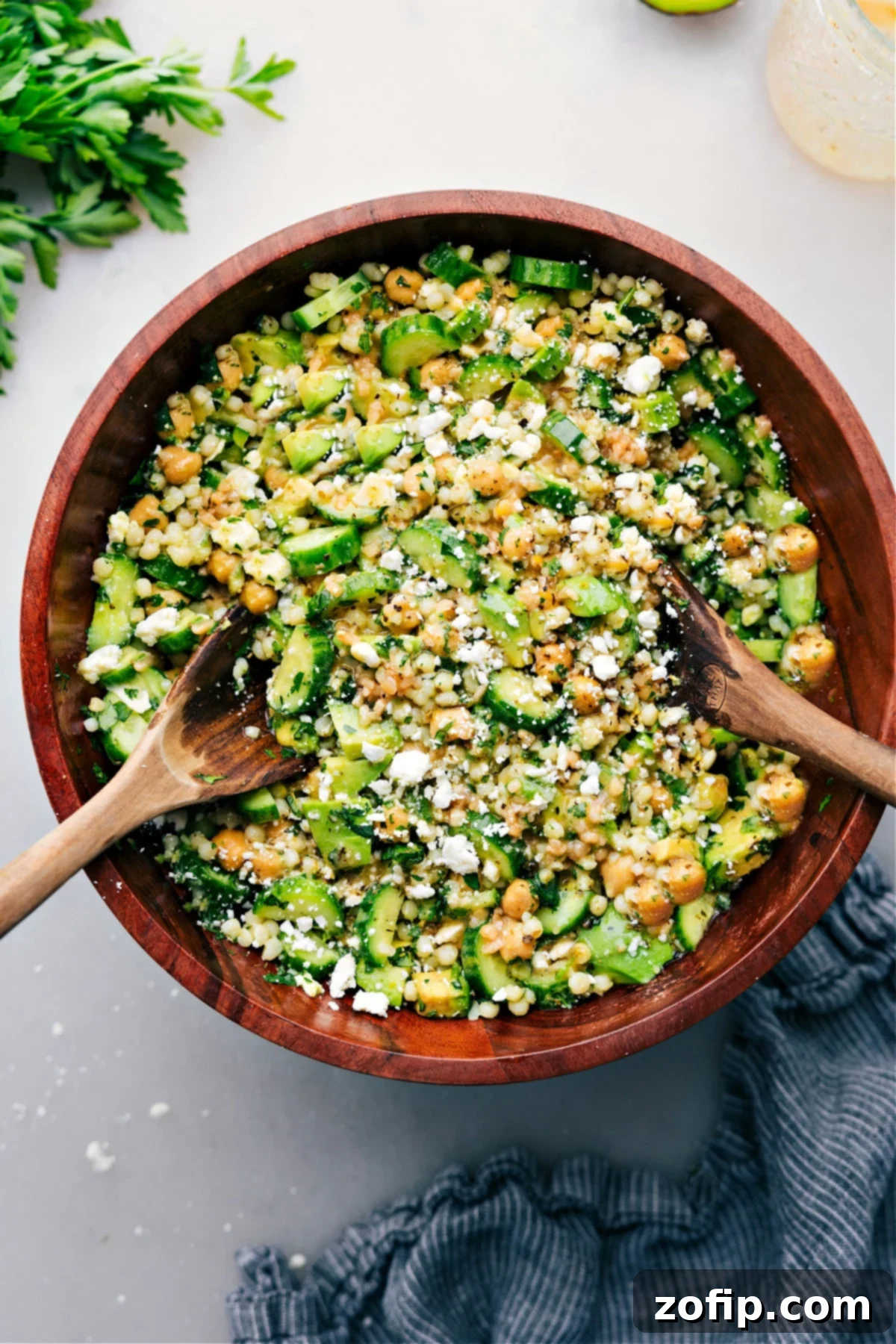 Cucumber Feta Salad in a bowl ready to be enjoyed, garnished with fresh herbs.