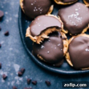 Close-up of a finished Rice Cake with Peanut Butter and Chocolate, highlighting its crispy base, creamy peanut butter layer, and smooth, hardened chocolate top with sea salt flakes.