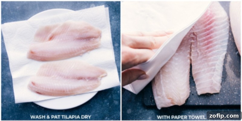 Process shot: Tilapia fillets being patted dry with paper towels before seasoning.