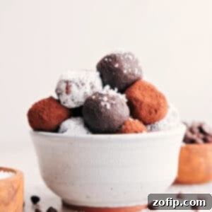 Finished chocolate truffles, some rolled in cocoa powder, some in shredded coconut.