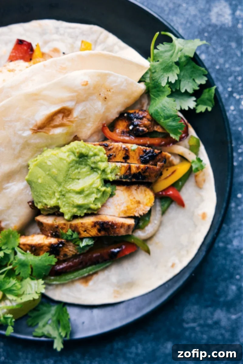 Close-up image of a chicken fajita in a tortilla