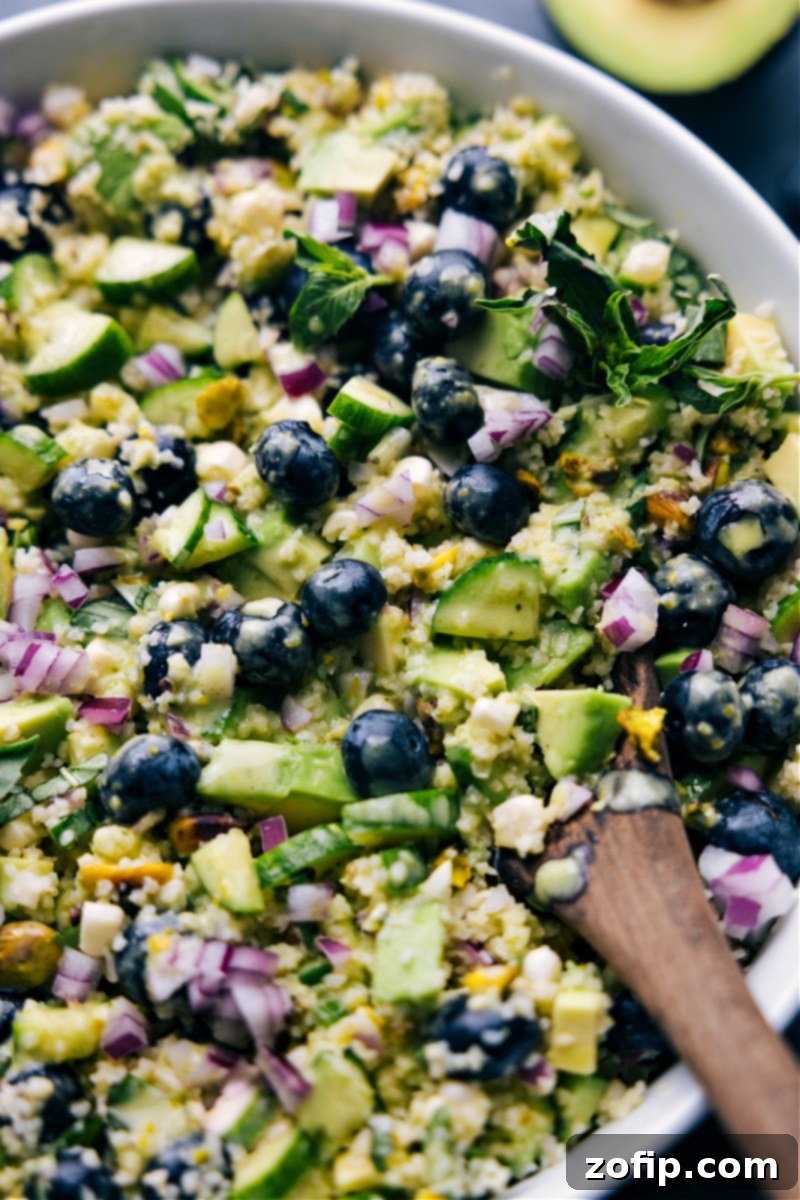 Our absolute favorite Blueberry Corn Salad, a picture of freshness and flavor, perfect for any occasion. Close-up overhead shot of a freshly prepared Blueberry Corn Salad, vibrant and ready to serve, highlighting the textures of corn, blueberries, and avocado