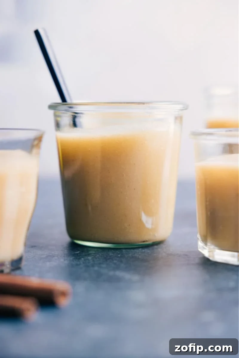 A glass container filled with freshly made homemade applesauce, showcasing its natural color and inviting texture.