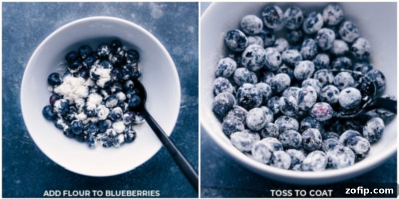 Fresh blueberries being gently tossed with a dusting of flour in a bowl, preparing them to be added to the bread batter.