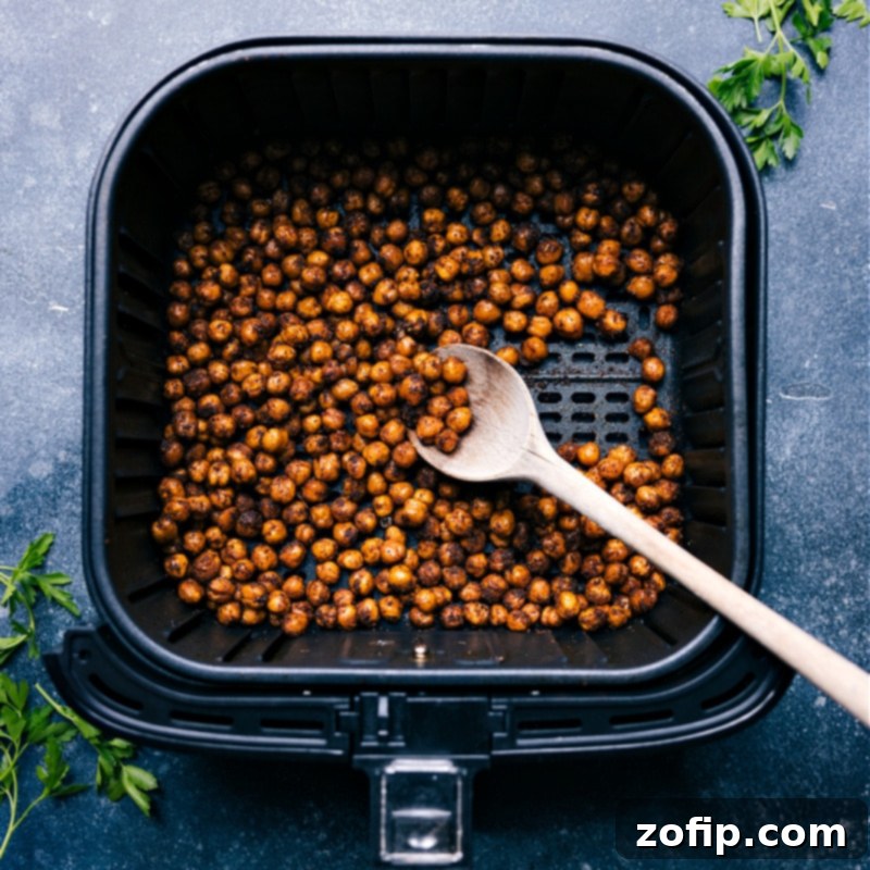 The Ultimate Air Fryer Guide: Cook Healthier, Faster, and Crispier Overhead view of Roasted Chickpeas in the air fryer, showcasing healthy, crispy snacking