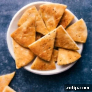 Homemade Pita Chips Baked or Air Fried 3 Crispy Homemade Pita Chips, ready for dipping.
