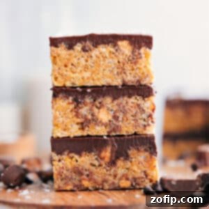 Peanut Butter Crunch Bars 3 Close-up of Peanut Butter Rice Krispie Treats, showing the gooey texture and chocolate topping.