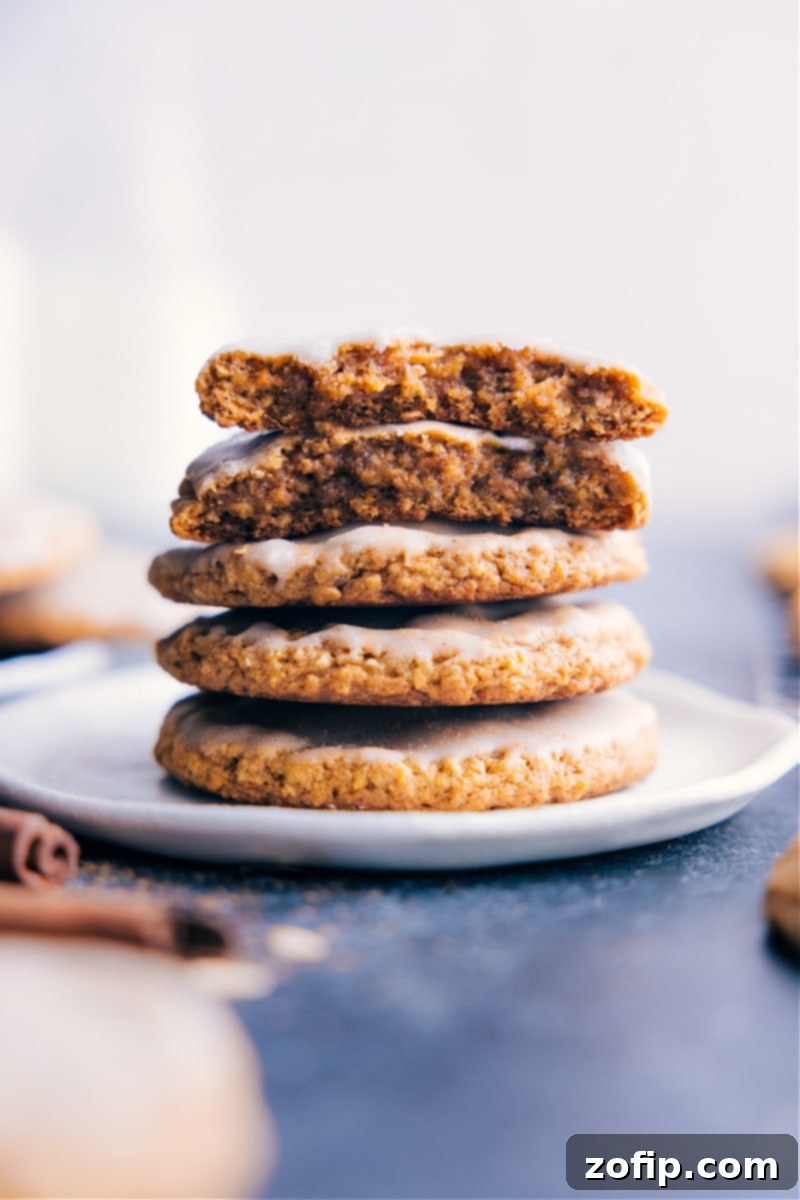 Plate of perfectly baked Pumpkin Oatmeal Cookies, some with a sweet glaze