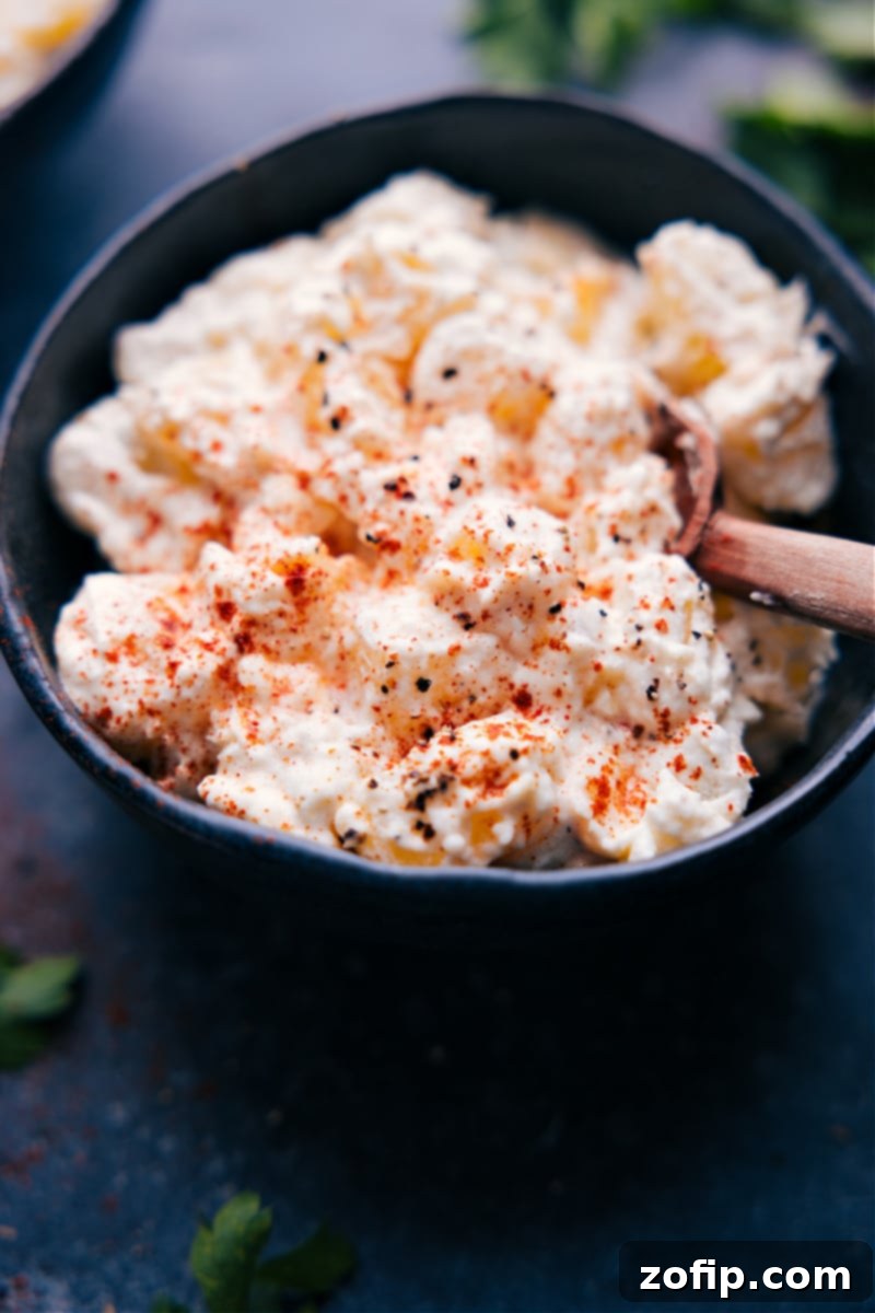 Overhead view of Creamy Potatoes garnished with paprika and herbs