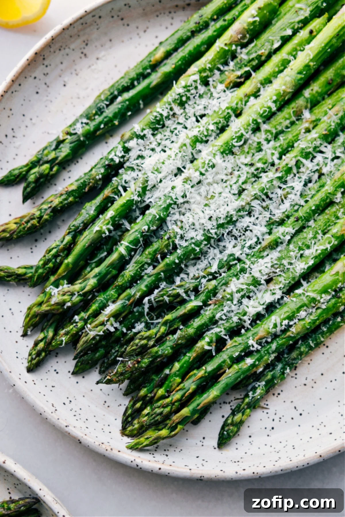 Easy And Delicious Roasted Asparagus The roasted asparagus on a plate ready to be served.