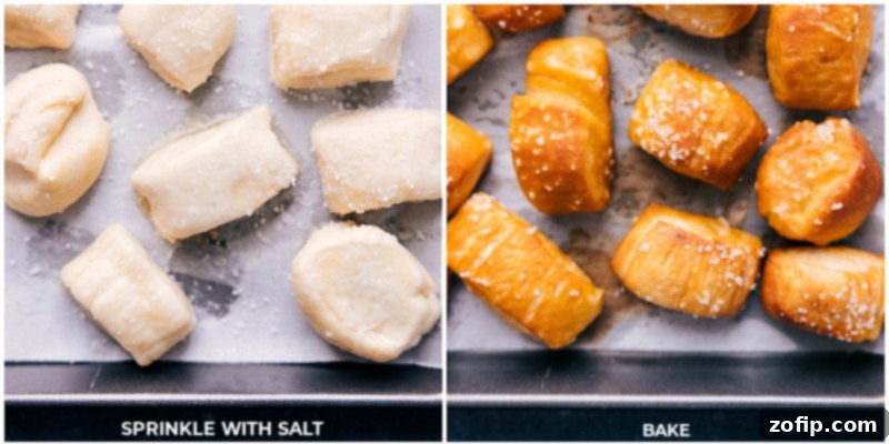 Overhead image of freshly baked, golden-brown Pretzel Bites on a baking sheet, some brushed with butter and salt, ready for serving.