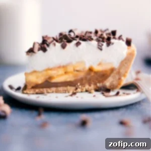 Finished Banoffee Pie, showcasing its layers of dulce de leche, bananas, and whipped cream.