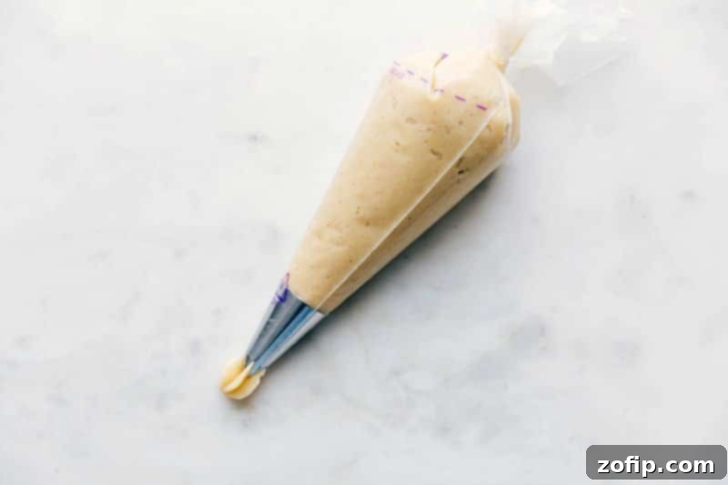 Churro Dough in Piping Bag - Ready to Create Delicious Treats Churro dough inside a pastry piping bag.