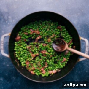 Deliciously Simple Frozen Peas 2 A bowl of delicious frozen peas with bacon and shallots.