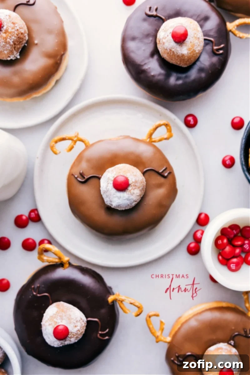 Charming Christmas Donuts crafted into Rudolph reindeer, perfect for festive holiday treats and gatherings. Overhead image of adorable Christmas Donuts decorated as Rudolph reindeer, on a festive background