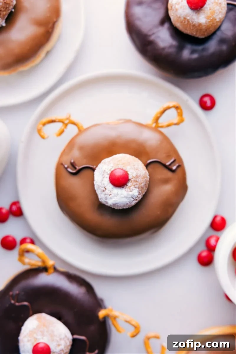 Our favorite Rudolph Reindeer Christmas Donuts: cute, festive, and a guaranteed hit for the holiday season! Up-close overhead image of the finished Christmas Donuts, perfectly decorated as Rudolph reindeer.