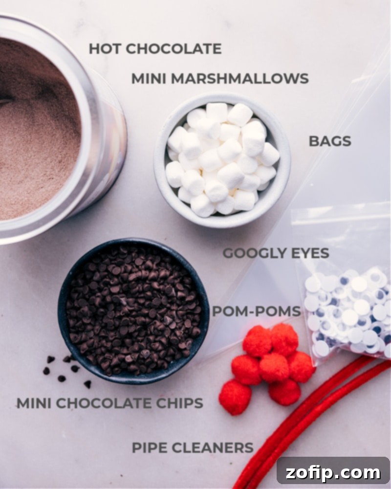 Collection of ingredients laid out for making Reindeer Hot Chocolate, including hot chocolate mix, chocolate chips, and marshmallows.