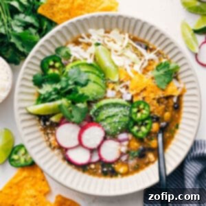 Delicious Chicken Pozole in a bowl with toppings.