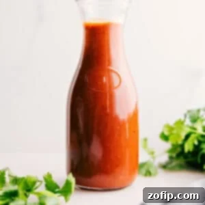 Homemade Enchilada Sauce 2 A vibrant red enchilada sauce, ready to be poured and enjoyed.