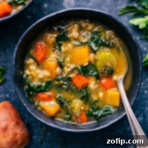 Savory Barley Delight 2 A steaming bowl of vegetable barley soup garnished with fresh herbs and Parmesan cheese.