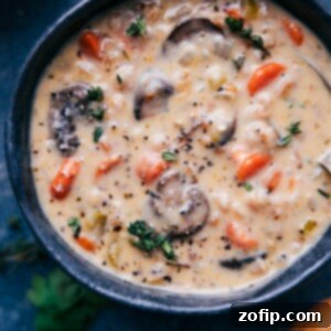 Close-up of Creamy Mushroom Carrot Farro Soup, a comforting and hearty meal. A bowl of creamy mushroom carrot farro soup ready to be served