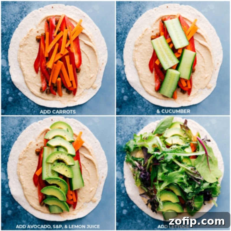 Layers of fresh carrots, cucumbers, avocados, and lettuce being assembled on tortillas with hummus and crispy chickpeas for healthy wraps.