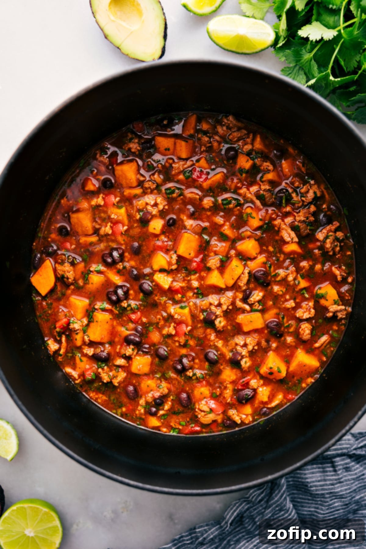 One Pot Beef Enchilada Soup Recipe A large pot of rich, simmering Beef Enchilada Soup, ready to be ladled into bowls and enjoyed by the family.