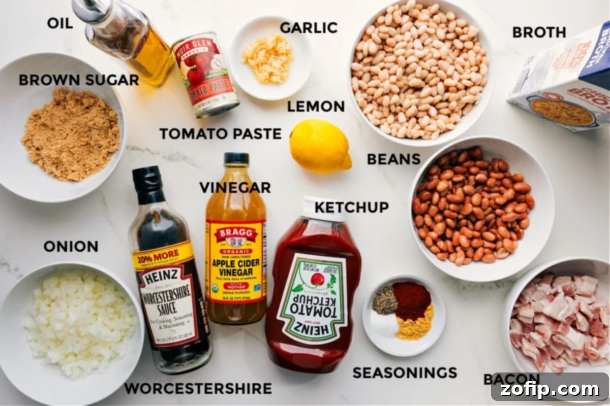 All essential ingredients for making the best homemade baked beans are neatly prepped and laid out on a wooden surface. This includes olive oil, brown sugar, a finely diced yellow onion, tomato paste, apple cider vinegar, Worcestershire sauce, minced garlic, a fresh lemon, classic ketchup, various types of beans (navy and pinto), a selection of savory spices, crispy cooked bacon, and a rich broth.