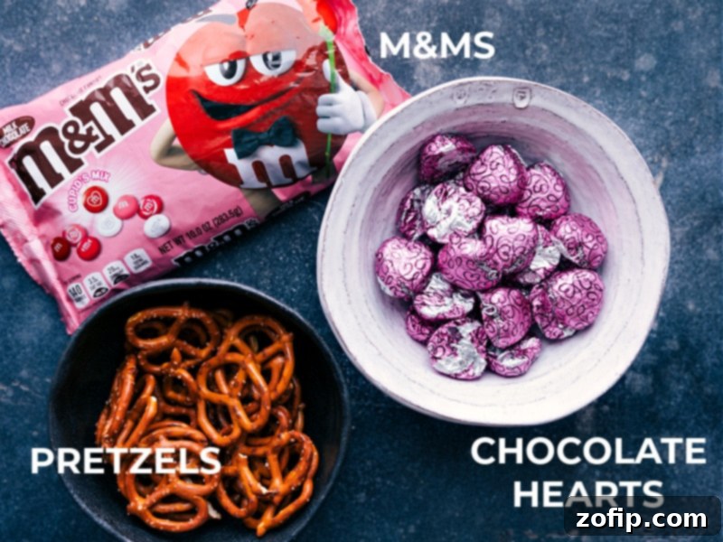 There are several options when purchasing Dove chocolate hearts--milk, dark, or milk & dark chocolate swirl. A view of the ingredients required for this recipe, including pretzels, Dove chocolate hearts, and red M&M's.