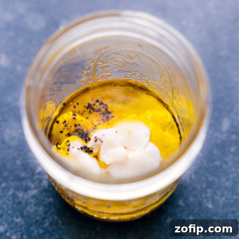 Fresh ingredients for Homemade Honey Mustard Vinaigrette, ready for mixing. Achieve the ultimate balance of sweet and tangy with a creamy texture for salads, marinades, or dips. An inviting overhead view of all the fresh ingredients laid out on a clean surface, meticulously prepared and ready to be combined for the Honey Mustard Vinaigrette.