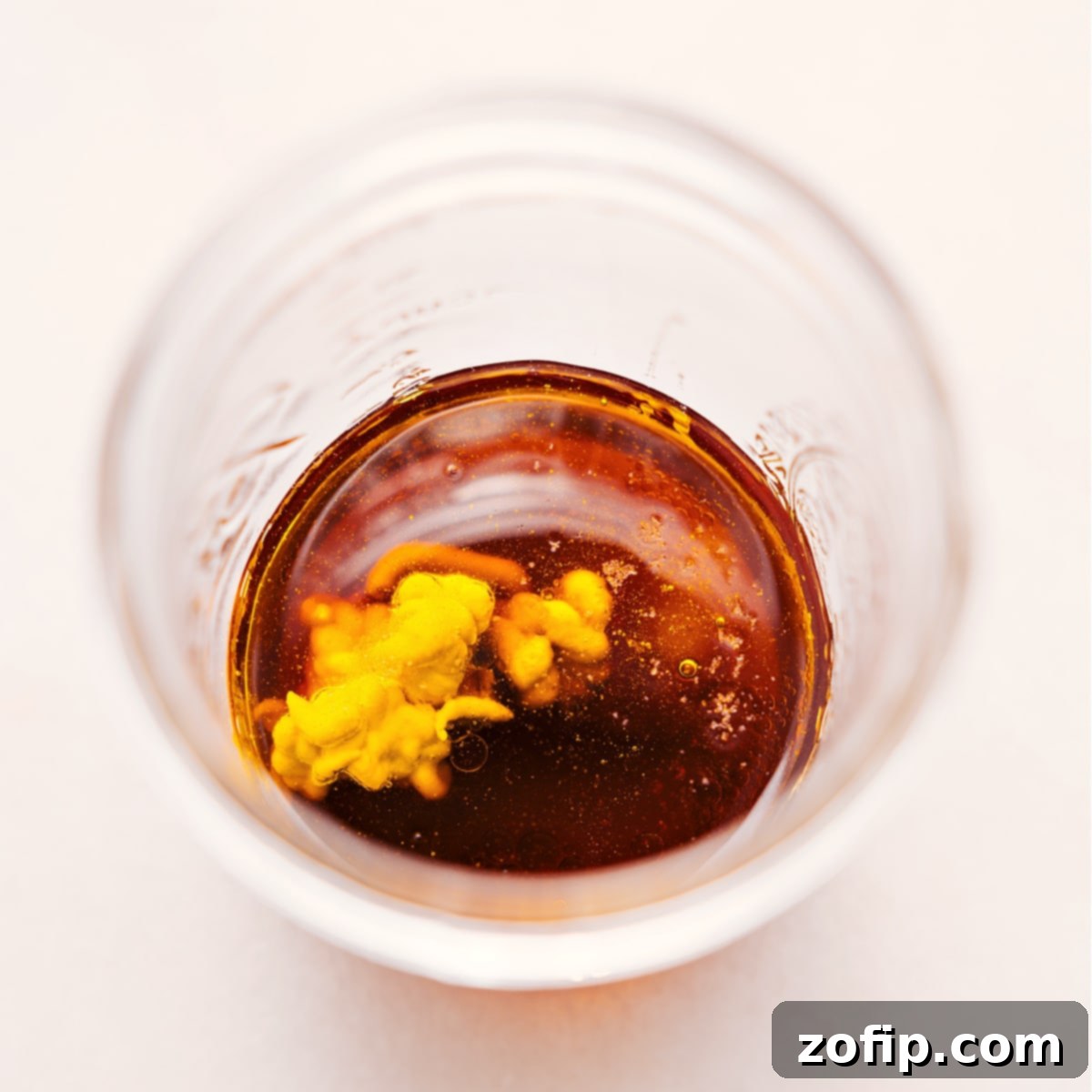 Simple Steps to Make White Balsamic Vinaigrette All the pre-measured ingredients for White Balsamic Vinaigrette are neatly placed in a glass mason jar, ready to be shaken and combined.