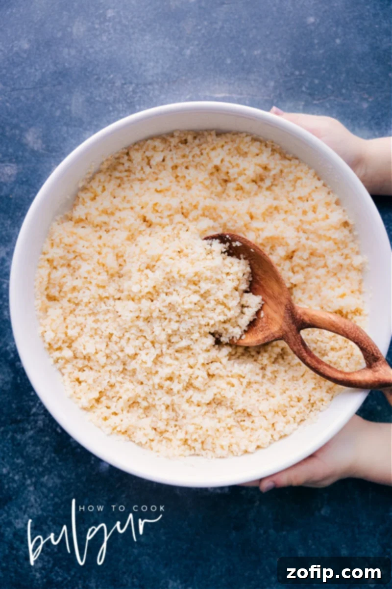 Overhead image of a beautifully cooked bowl of fluffy bulgur wheat, ready to be served as a side dish.