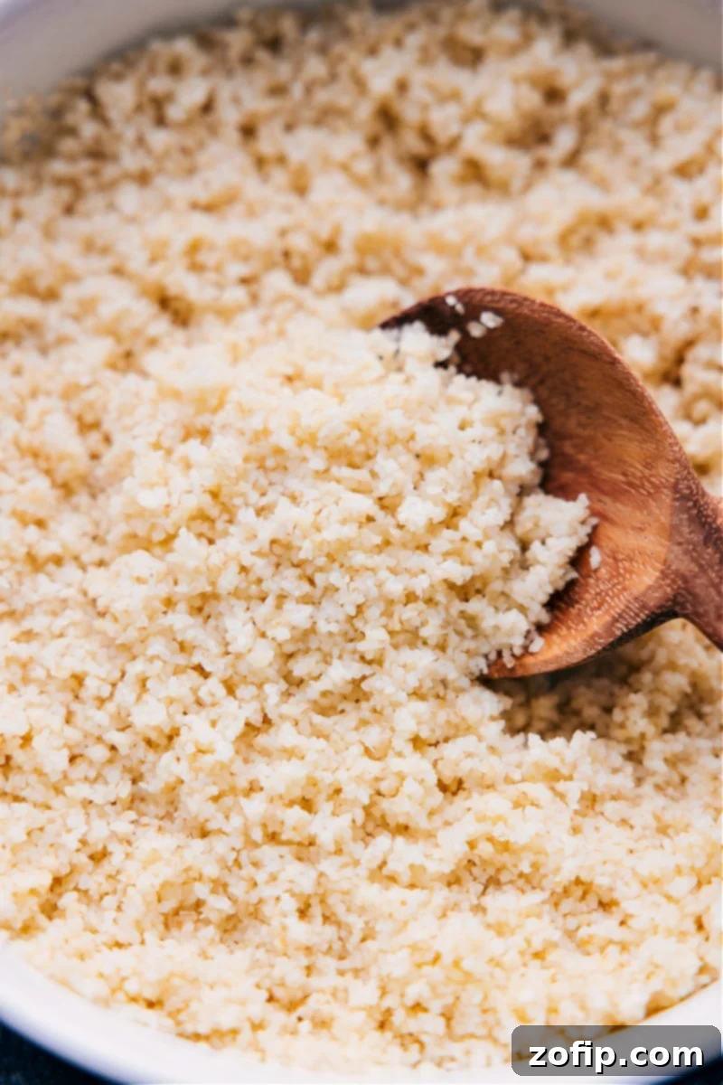 Up-close overhead image of the perfectly cooked, fluffy bulgur wheat recipe ready to be served in a bowl.