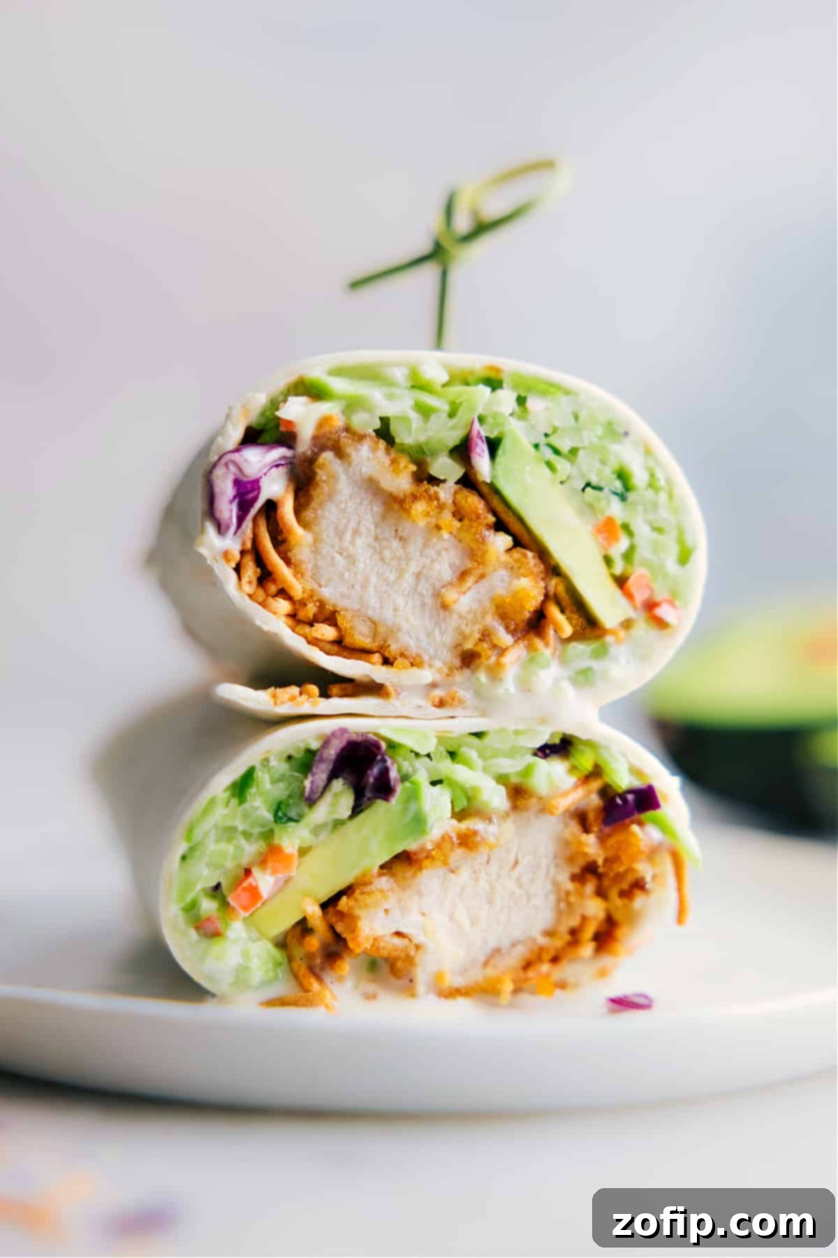 The Best Asian Chicken Wraps for a Quick Dinner Delicious Asian Chicken Wraps stacked high, showcasing their vibrant filling and golden-brown crispy chicken.