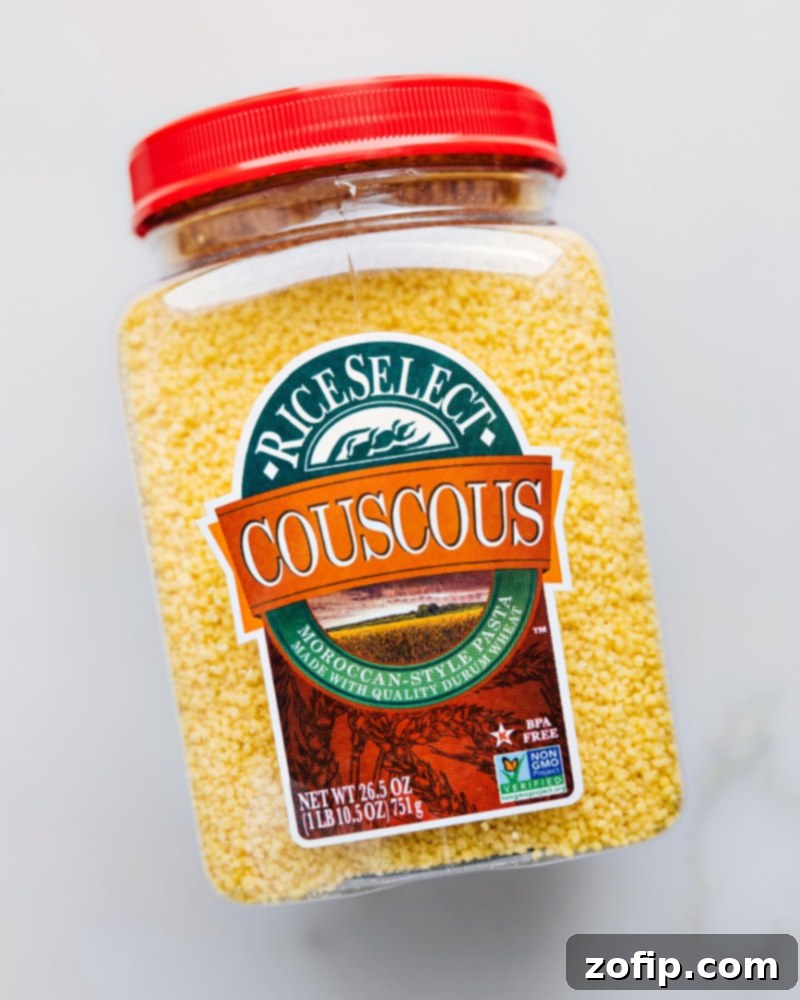 Close-up of dry Moroccan couscous grains, ready for cooking.