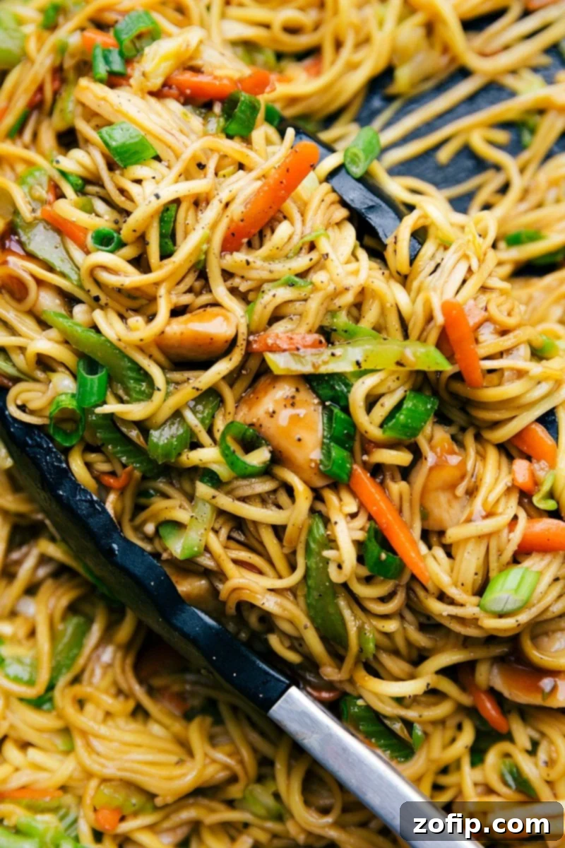 Delicious Chicken Chow Mein in a large skillet, brimming with fresh, colorful vegetables and perfectly cooked noodles, ready to be served.