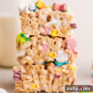 Close-up of a stack of Lucky Charms Bars, showcasing their vibrant colors and gooey texture.