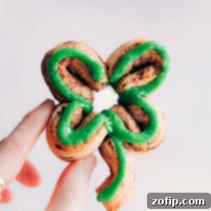 Lucky Shamrock Cinnamon Rolls 2 A beautifully decorated Shamrock Cinnamon Roll with green icing, featured as the main recipe image.