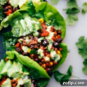 Southwestern Turkey Lettuce Wraps 2 Close-up of a prepared Turkey Lettuce Wrap, featuring seasoned ground turkey, fresh vegetables, and a vibrant cilantro-lime sauce, ready to be enjoyed.