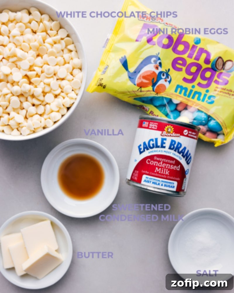 Ingredient shot showing all essential items for Robin Egg Fudge: sticks of butter, white chocolate chips, a shaker of salt, a can of sweetened condensed milk, and a bag of mini robin eggs.