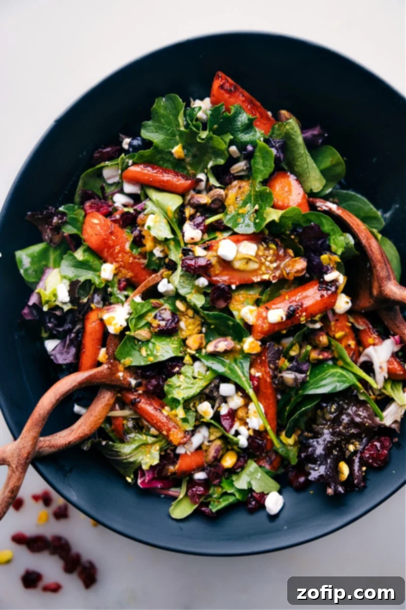 Roasted carrot salad in a bowl ready to be served, showcasing vibrant colors and textures.