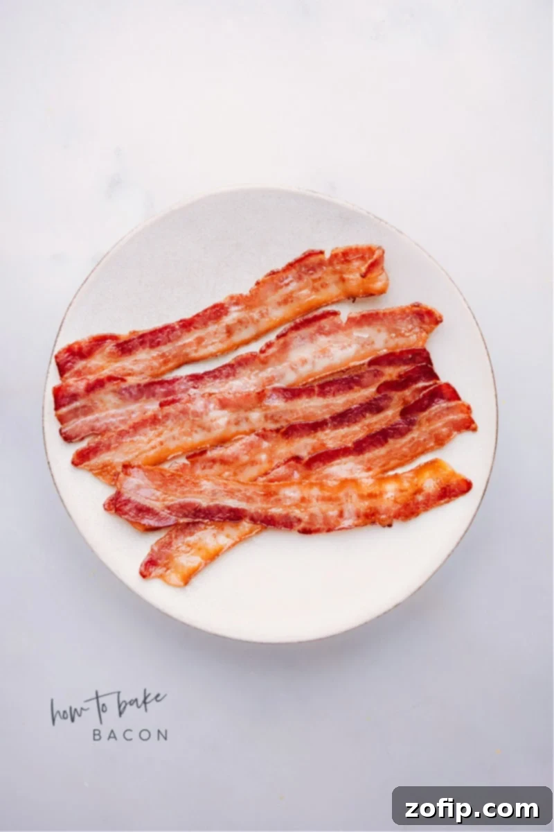 Overhead image of perfectly baked bacon strips on a cooling rack