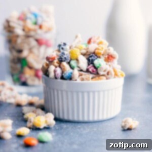 Final White Chocolate Chex Mix: Ready to Enjoy! A final image of the prepared White Chocolate Chex Mix in a festive bowl, showcasing its crunchy texture and colorful M&M's.