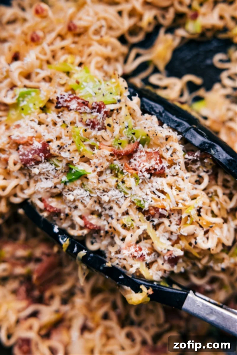 Close-up overhead view of Fried Cabbage Ramen served in a bowl, ready to be enjoyed, highlighting its rich texture and steam